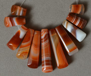 Red and white agate graduated trapezoid beads.