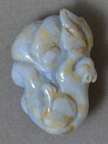 Carved squirrel pendant from blue and yellow agate.