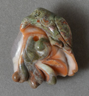 Pendant bead bird carving from multi color agate from Idaho.