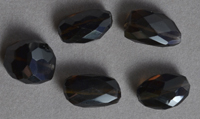 Five faceted nugget beads from smoky quartz.