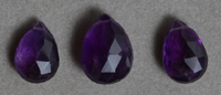 Three amethyst faceted briolette beads.