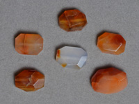 Faceted oval beads from carnelian.