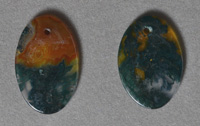 Two moss agate flat oval pendant beads.