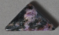Triangle shaped charoite pendant bead.