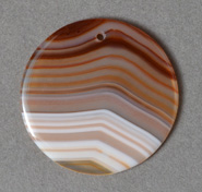 Pendant bead from cream, rust and brown agate.