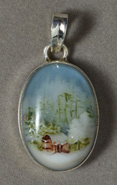 Pendant with painted log cabin cameo scene.