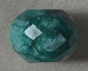 Large emerald faceted rondelle bead.