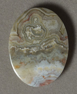 Crazy lace agate flat oval pendant bead.