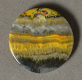 Yellow banded opal round pendant bead.