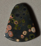 Bell shaped plumite jasper pendant bead.
