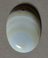 Piranha agate oval pendant bead.
