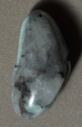 Long Columbian emerald nugget bead.
