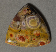 Poppy jasper rounded triangle shaped pendant bead.