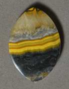 Yellow banded opal pendant bead.