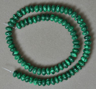 Man made malachite rondelle beads.