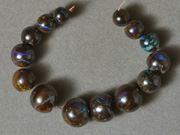Graduated round beads from Australian boulder opal.