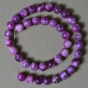 Strand of unusual round beads from sugilite.