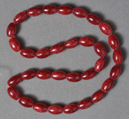 Ruby red calcite barrel shaped beads.