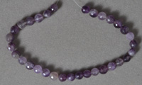 Different shades of amethyst 6mm faceted rounds.