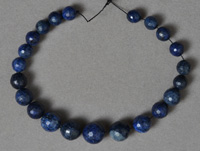 Graduated sized lapis with pyrite faceted round beads.