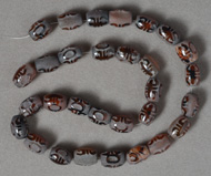 Small carved agate barrel beads