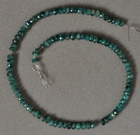 Short strand of genuine emerald rondelle beads.