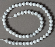 Round beads from white jasper with grey veins.