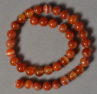Red, white and grey agate round beads.