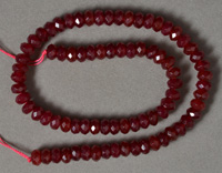 Ruby colored jade faceted rondelle beads.