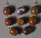 Several large barrel beads from American multi color agate.
