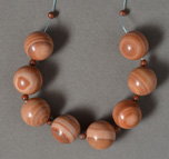 Several large red banded jasper round beads.