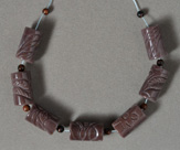 Carved sunset agate drum beads.