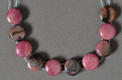 Double drilled rhodonite coin beads.