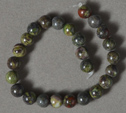 Short strand of 6mm bloodstone round beads.