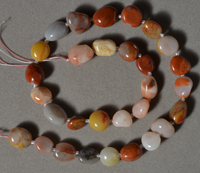 Strand of tumbled agate nugget beads.