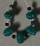 Carved and faceted onyx beads.
