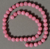 8.5mm round beads from pink quartz.