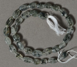 Tourmaline rutilated quartz oval beads.