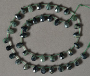 Faceted drop beads from green kambaba jasper.