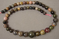 Graduated round beads from earth tone shades of tourmaline.