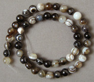 Round beads from black lace agate.