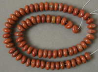 Dark red colored jasper rondelle beads.