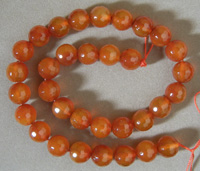 Faceted round beads from red agate.