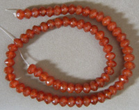 Faceted rondelle beads from red agate.