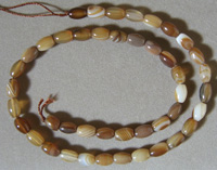 Barrel beads from brown and white striated agate.