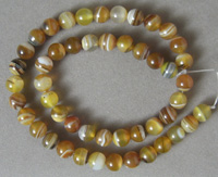 Round beads from gold and white.