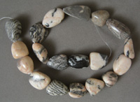 Nugget beads from zebra jasper with red.
