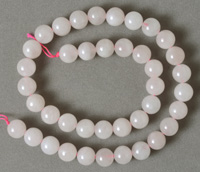 10mm round beads from light colored rose quartz.