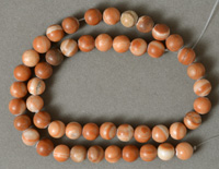 8 mm round beads from red malachite.