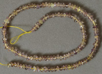 Small light colored ametrine rondelle beads.